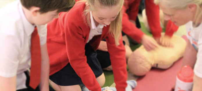 Children learning CPR