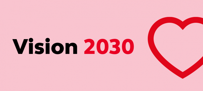 A graphic of a red heart next to text that says 'Vision 2030'