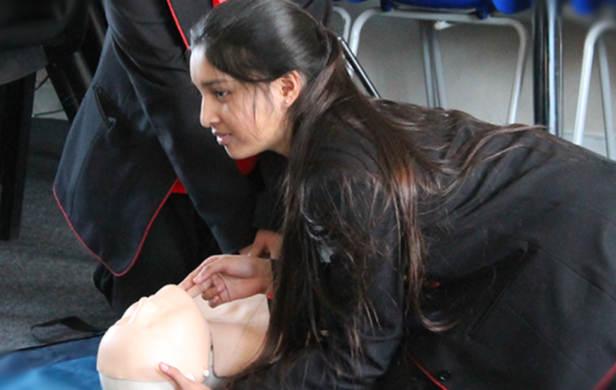 Image of a student practicing CPR