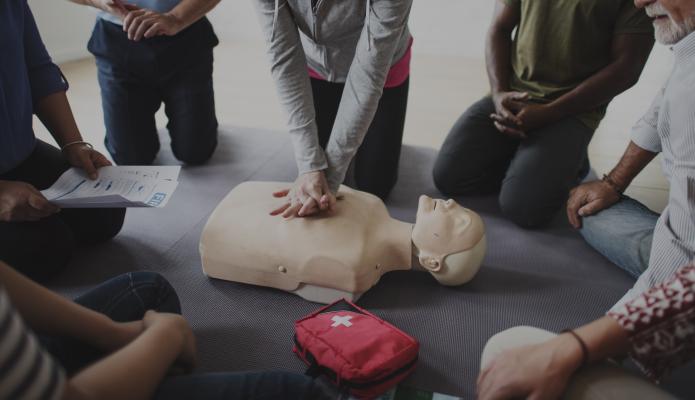Instructor teaching CPR on a mannikin